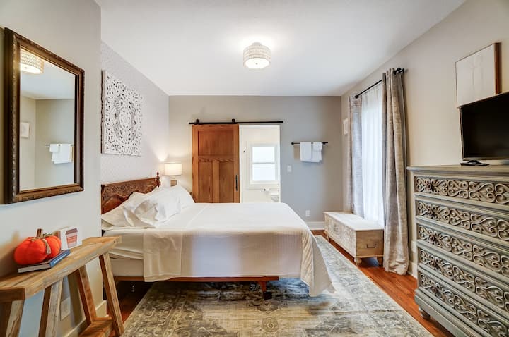 Downstairs bedroom with attached full bath