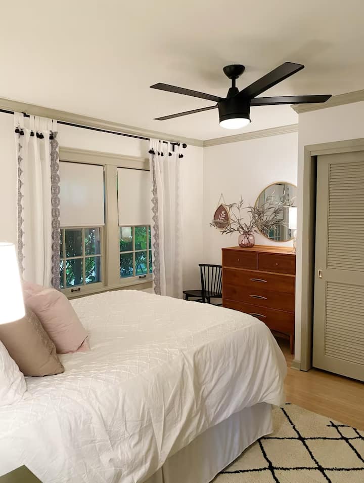 A very comfortable main bedroom with a queen sized bed, dresser and lots of closet space. 