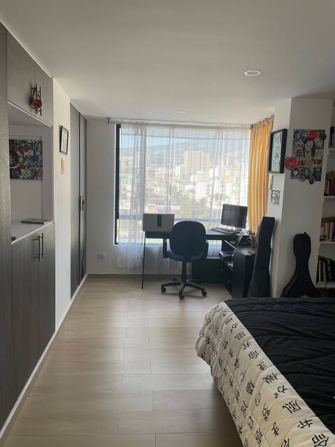 Room in a beautiful apartment, overlooking the volcano.