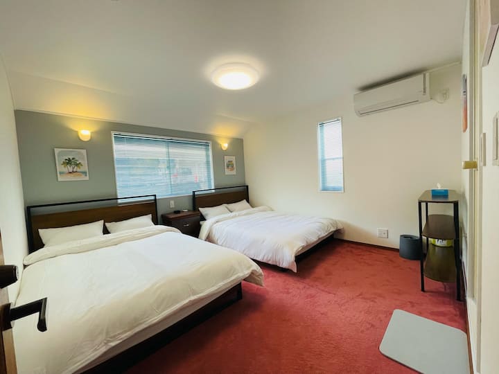 Each carpeted bedroom features its own private bathtub, toilet, and shower.