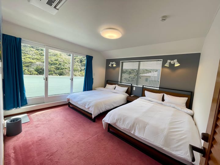 Each carpeted bedroom features its own private bathtub, toilet, and shower.