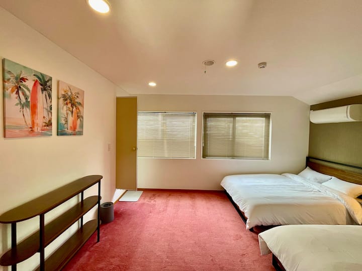 Each carpeted bedroom features its own private bathtub, toilet, and shower.