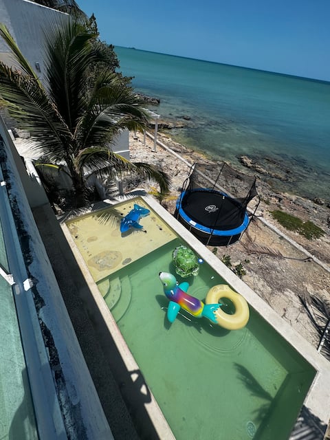 Beach house with pool, bouncy castle and video games