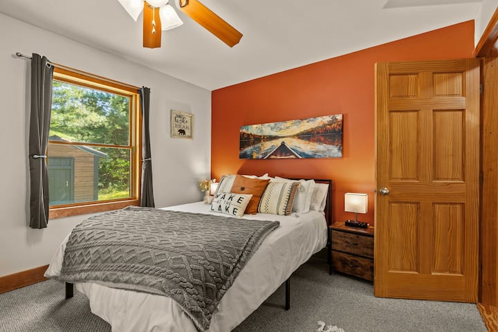 Cozy first floor bedroom with queen size bed and 40" smart tv.