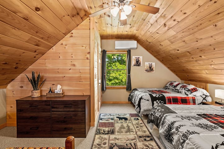 Loft bedroom; 2 double beds, 1 twin and a half bath.