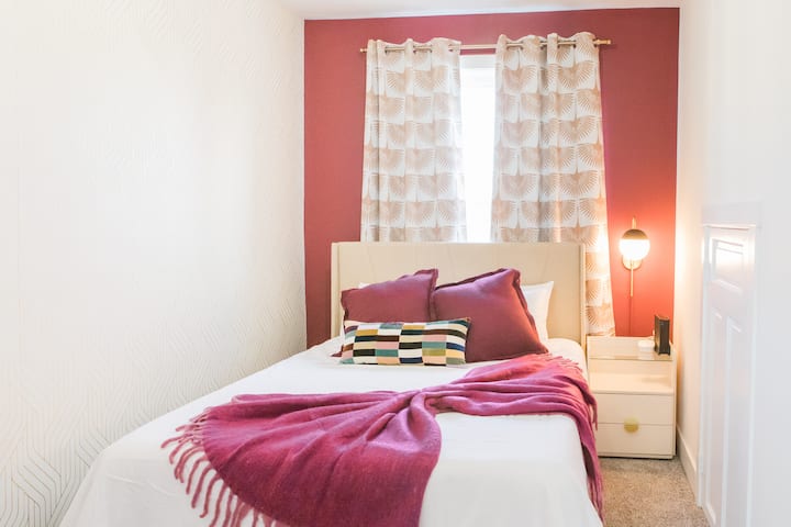 Comfy and cozy queen side bed has fluffy pillows and throw blanket(s).