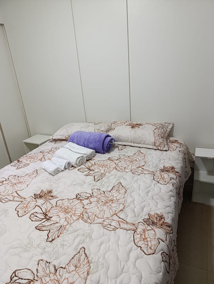 bedroom with double bed, air conditioning, blackout, countertop, sideboard.