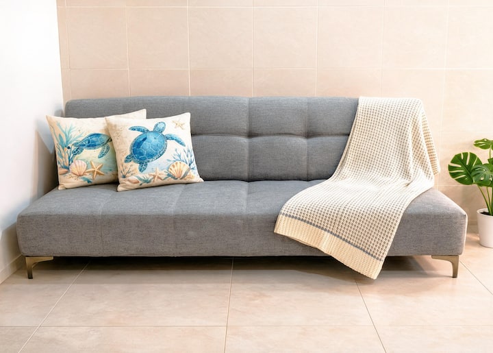 Sofa bed sleeps 1 adult or 2 kids — the room does double duty without feeling like it.