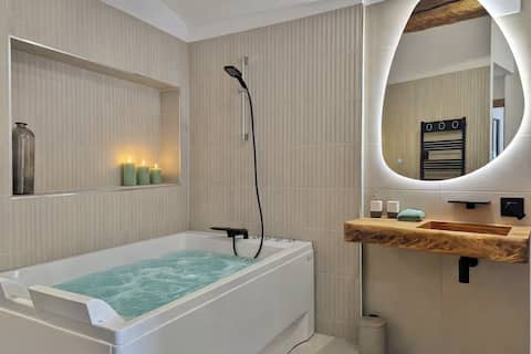 Hot Tub & Massage Suite • Relaxation at Le Petit Raho