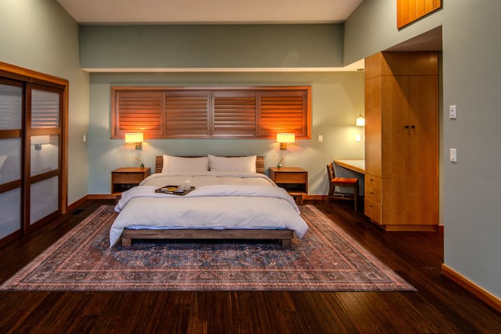 Large comfortable king bed in primary bedroom. 