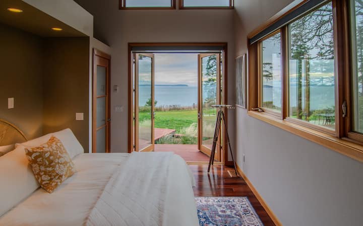 French doors with incredible views of Admiralty Bay and Port Townsend. Wake up to the breathtaking peaks of the mountains on the Olympic Peninsula visible on the horizon.  