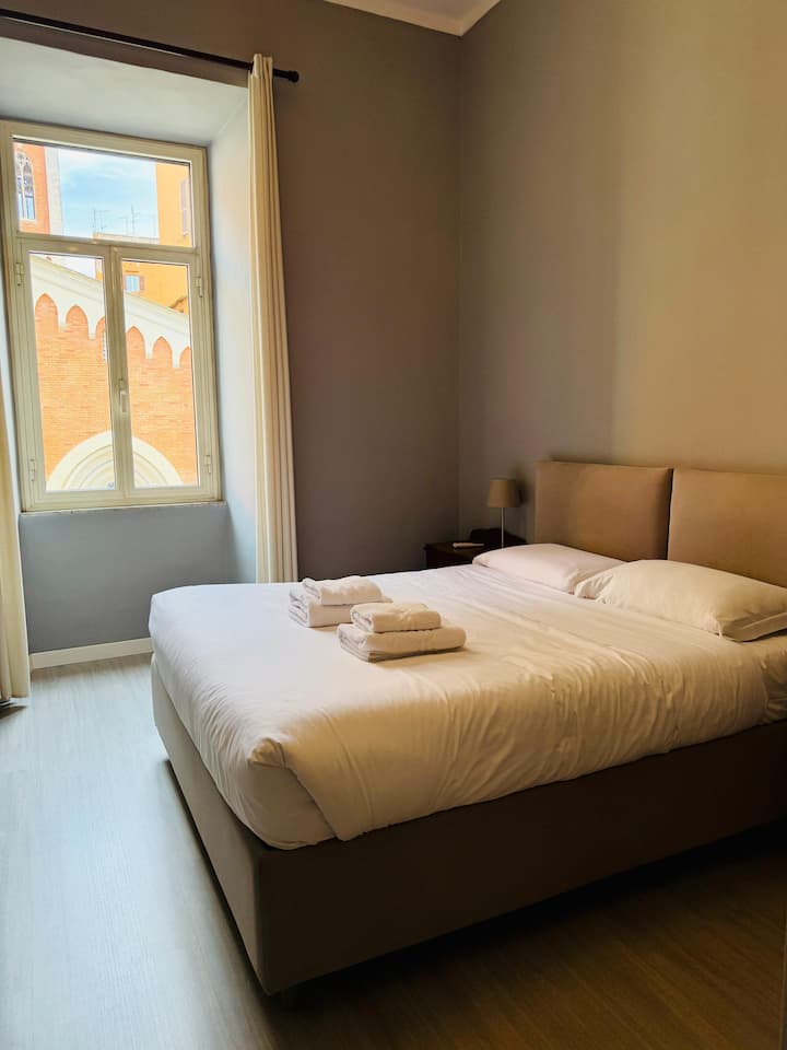 A bedroom with a very comfortable bed, 21mm Memory mattress, two Memory pillows, a small closet with dresser, two nightstands and hangers. Decorated by combining the beauty of antique family furniture with other contemporary objects.