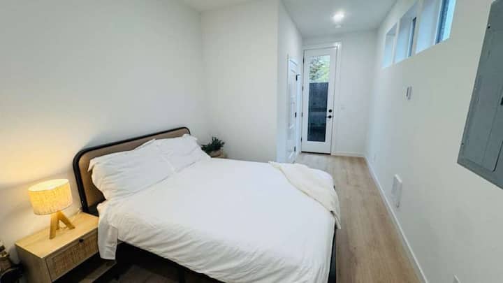 queen-sized bed and side table