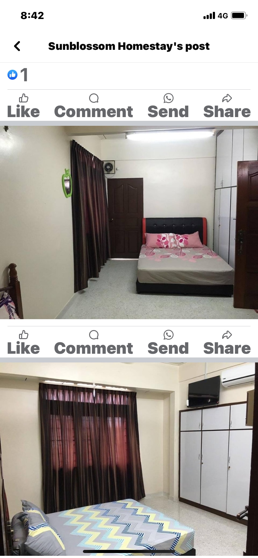 A well-lit bedroom features a spacious bed adorned with decorative pillows. Dark curtains frame a window, allowing natural light to enter. A storage unit with multiple compartments and a small television are visible, complementing the room's practical layout.