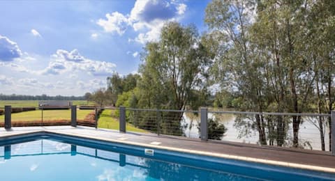 Lagoon-Side Retreat with Pool. Sleeps 10
2kms CBD.