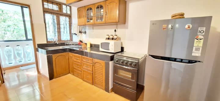 Feel at home with our spacious and fully equipped kitchen, thoughtfully stocked with everything needed for a comfortable stay. Guests have access to cookware, utensils, cutlery, crockery, a refrigerator, microwave & multi-burner cooking range.