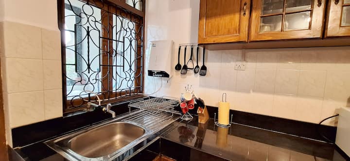 Feel at home with our spacious and fully equipped kitchen, thoughtfully stocked with everything needed for a comfortable stay. Guests have access to cookware, utensils, cutlery, crockery, a refrigerator, microwave & multi-burner cooking range.