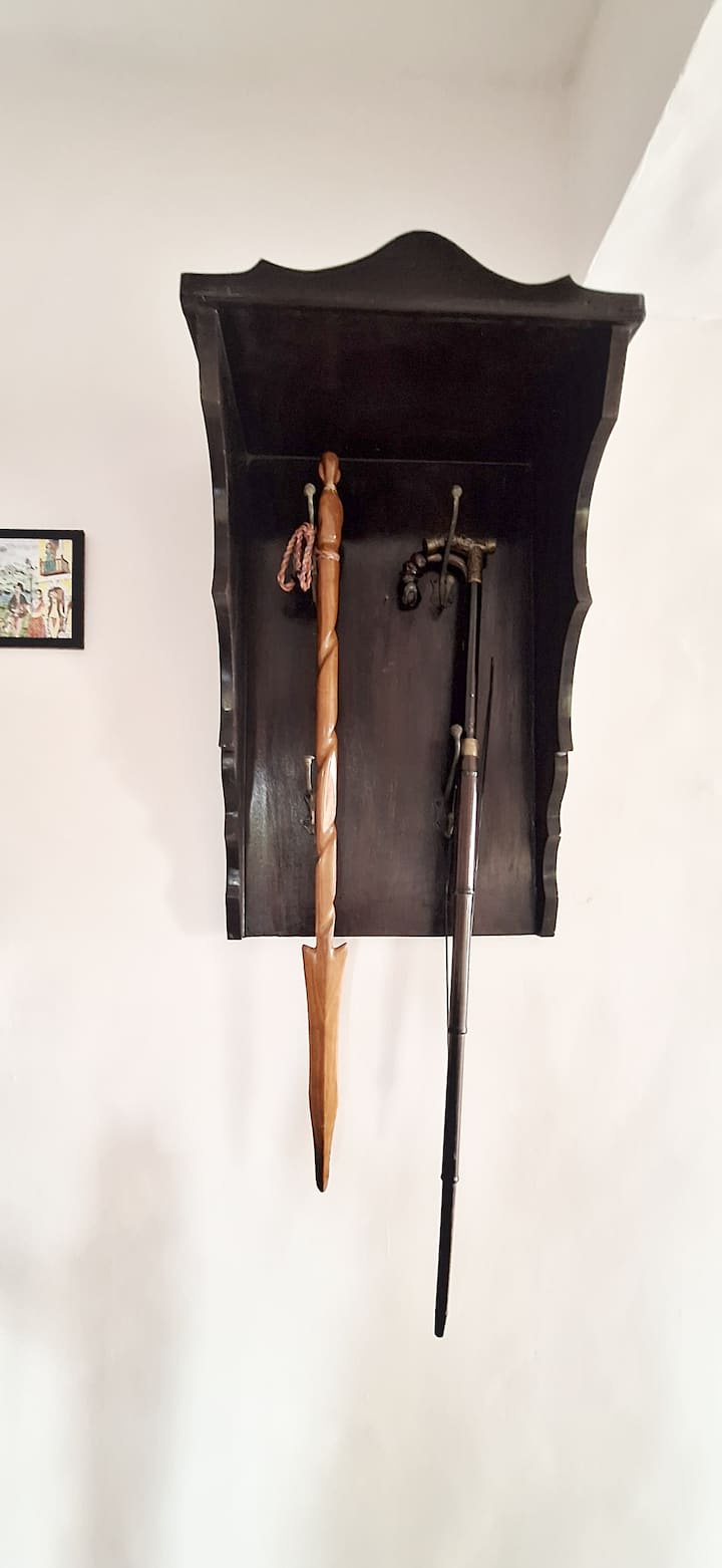 Family heirlooms, paintings, and treasured accessories from the late grandfather of owner add character and heritage to the space.