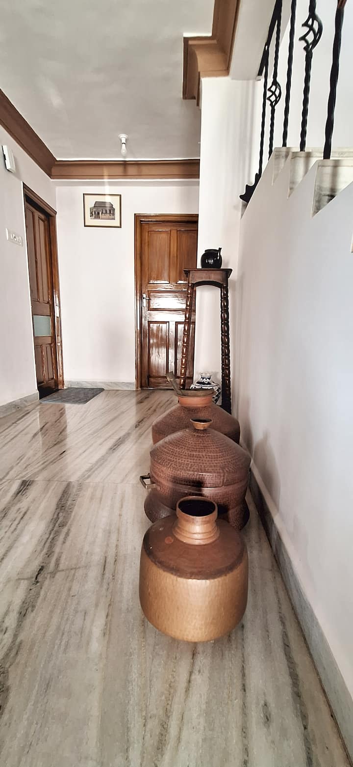Family heirlooms, paintings, and treasured accessories from the late grandfather of owner add character and heritage to the space.