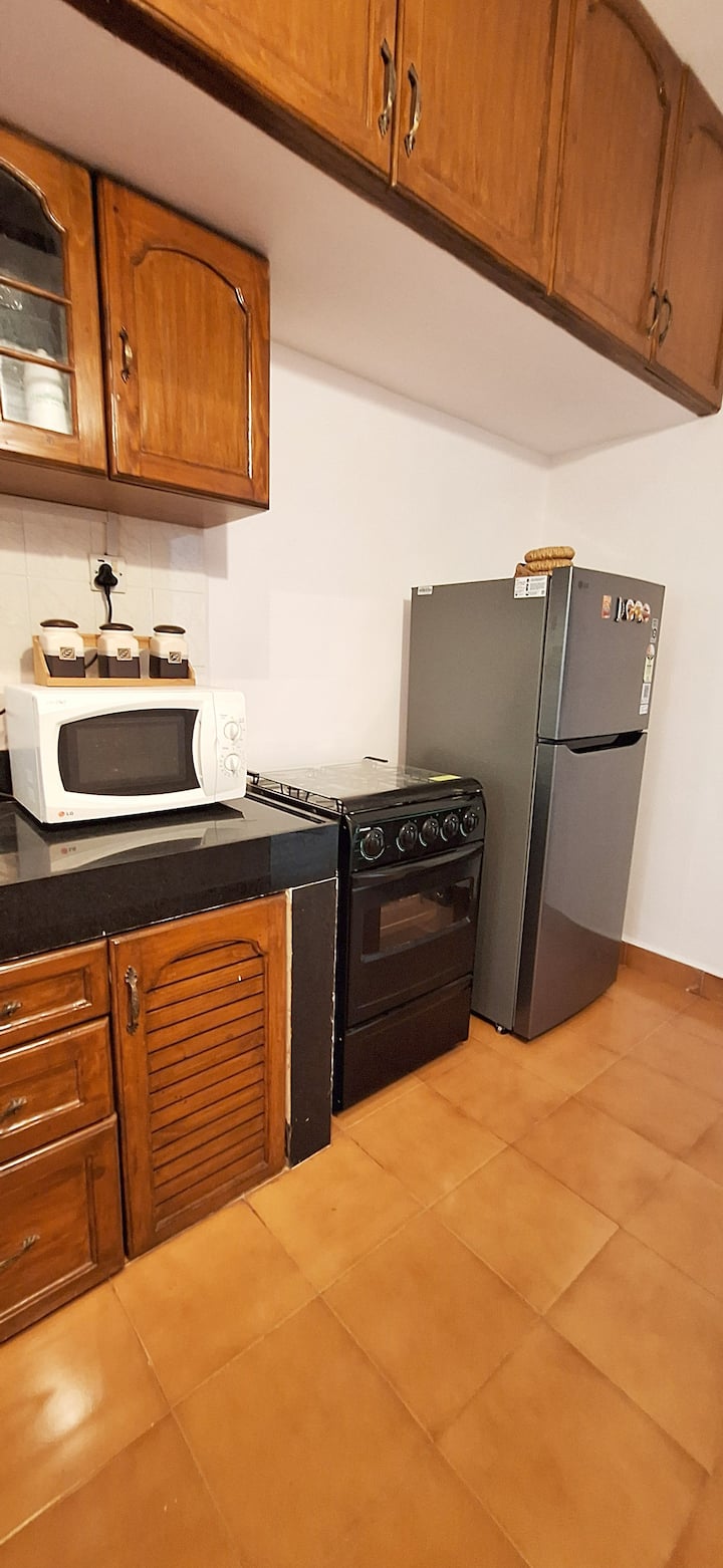 Feel at home with our spacious and fully equipped kitchen, thoughtfully stocked with everything needed for a comfortable stay. Guests have access to cookware, utensils, cutlery, crockery, a refrigerator, microwave & multi-burner cooking range.