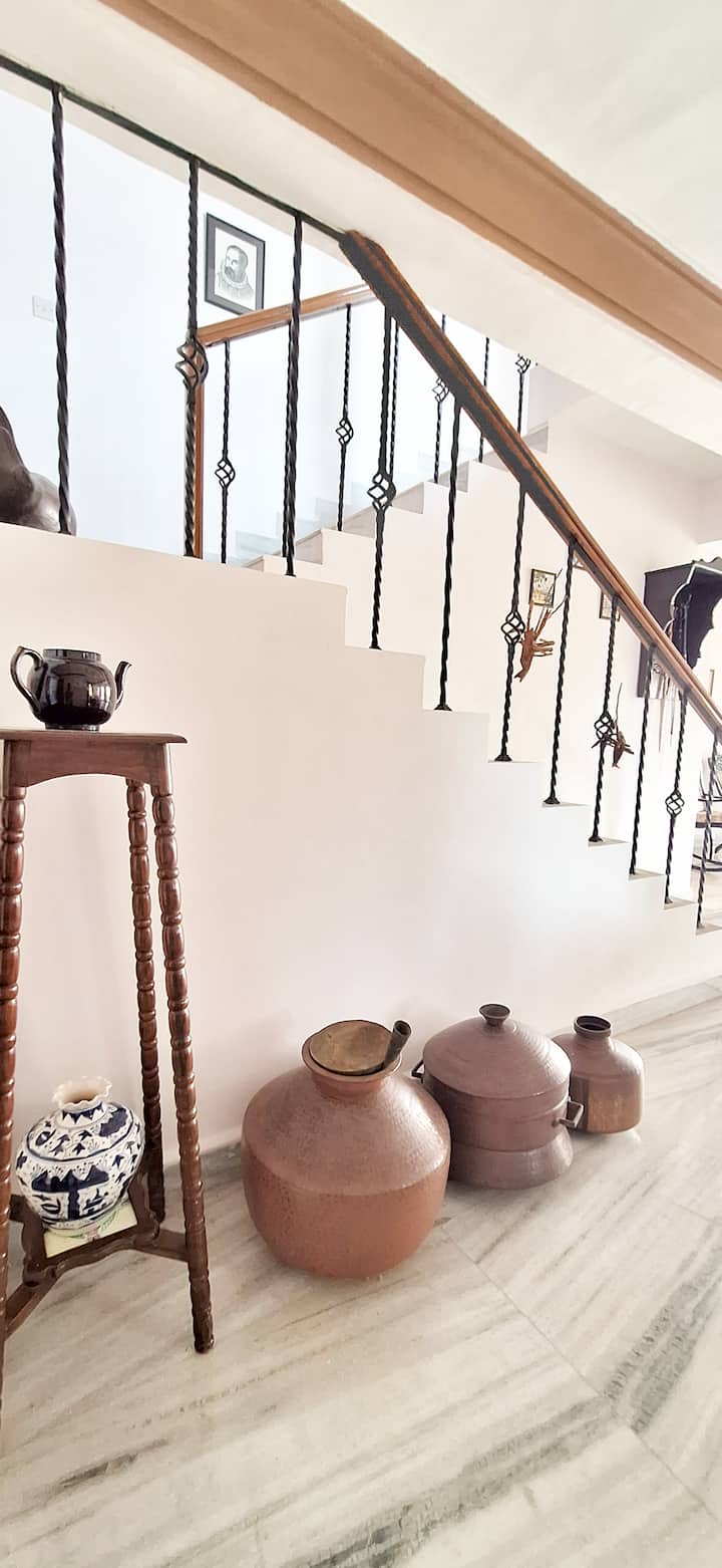Family heirlooms, paintings, and treasured accessories from the late grandfather of owner add character and heritage to the space.