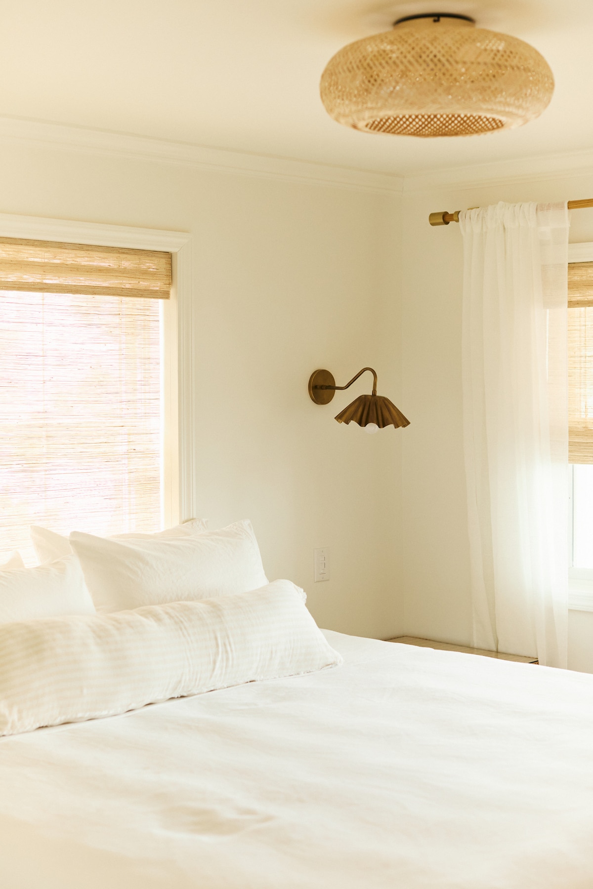 Custom touches like bronze sconces that are individually controlled on each side for ultimate comfort, reading, and personal preferences. 