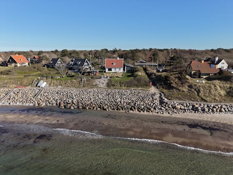 Large private cottage 1st row to good beach