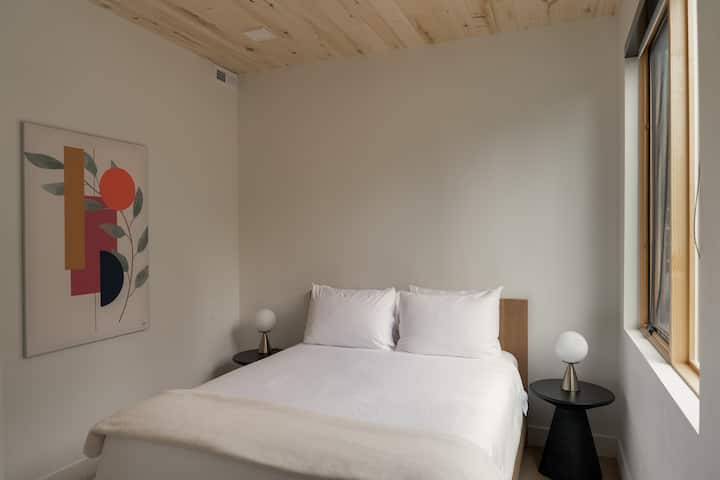 Bedroom 3 features a queen bed.