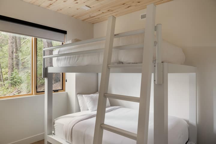 Bedroom 2 features a queen-over-queen bunk bed.