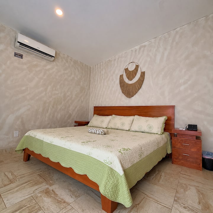 Our Master Bedroom features a spacious King-size bed for two, direct pool access through sliding patio doors, and a private AC system with remote control.