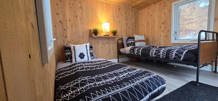 Note: This is not a third bedroom within cottage but the Bunkie outside and available for additional charge/night. Kindly contact us if interested in using this space.  Twin bed and trundle.  Trundle can be moved under bed for additional space
