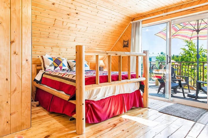 Cozy sleeping area with direct access to the private balcony, perfect for morning coffee or fresh air.