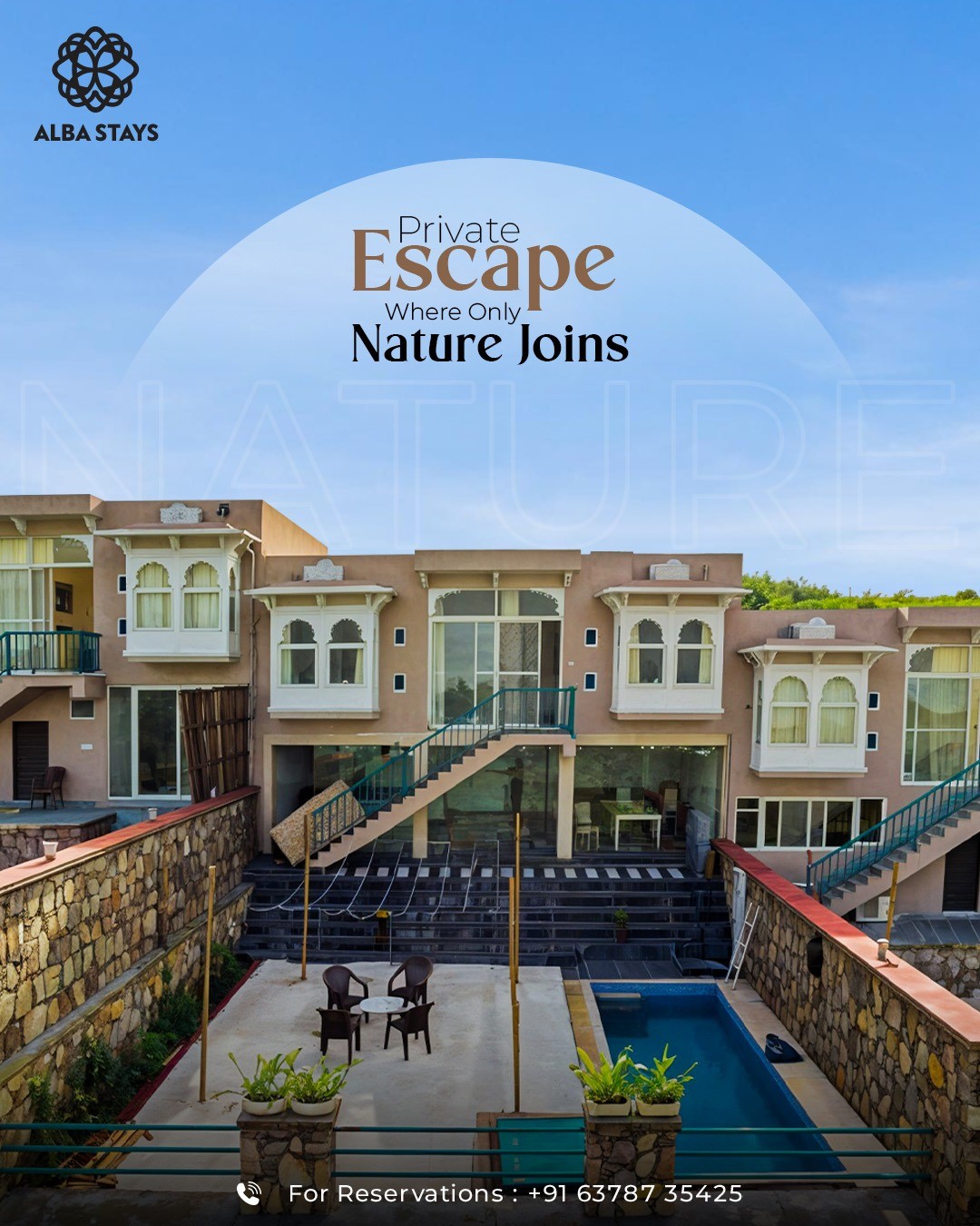 A contemporary villa is depicted, featuring a well-maintained exterior with stone accents. A private pool can be seen, complemented by seating arrangements. Lush greenery and a clear sky enhance the setting, creating a serene escape that harmonizes with nature.