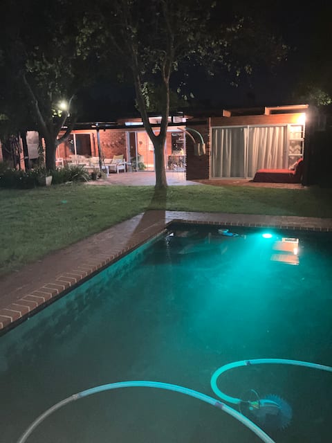 Retro Red Stone Villa with pool & lush garden