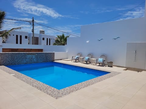 Beach house with a pool near the sea