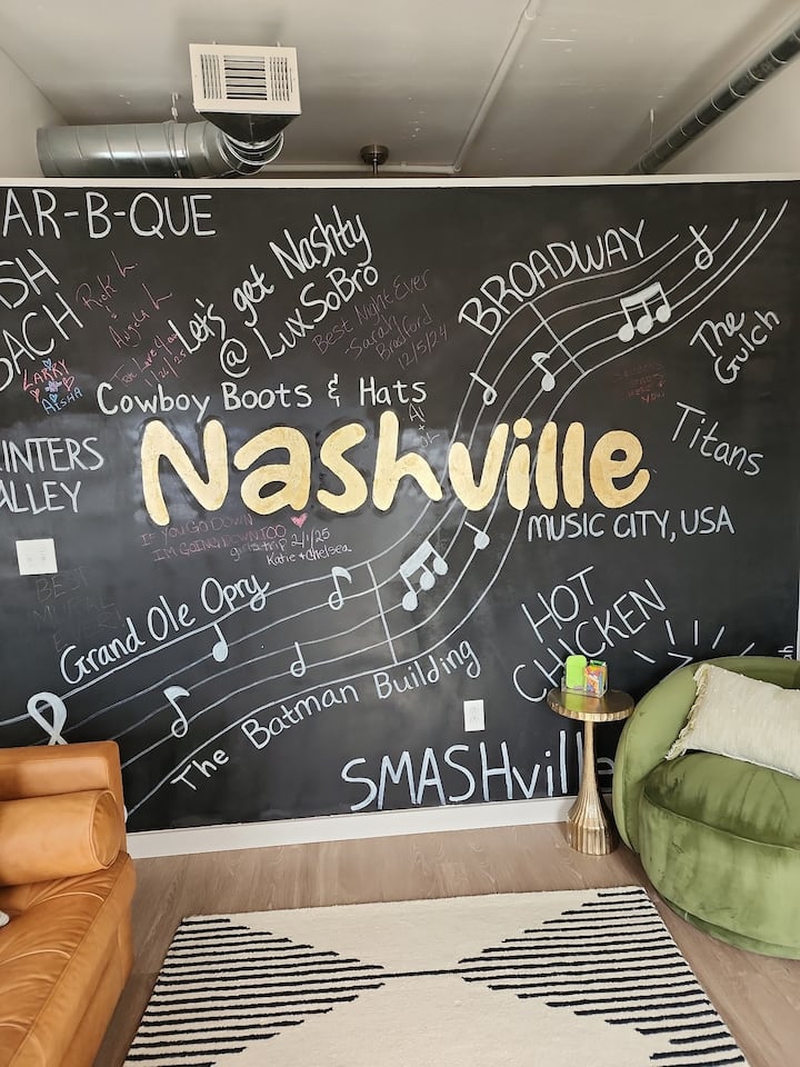 Living Room | Nashville Chalkboard Mural | Main Floor
Celebrate Music City with this standout chalkboard wall—hand-lettered with iconic spots and Nashville pride, adding a playful and personalized touch to your lounge area.