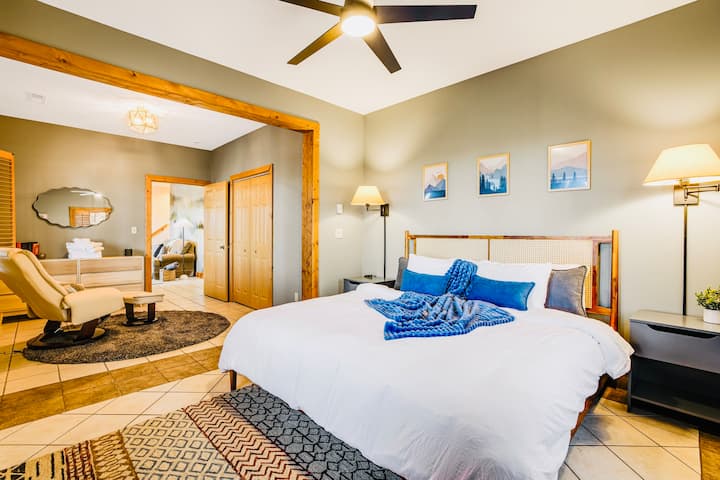 This beautiful, spacious and cozy bedroom has king size bed, and a massage chair
