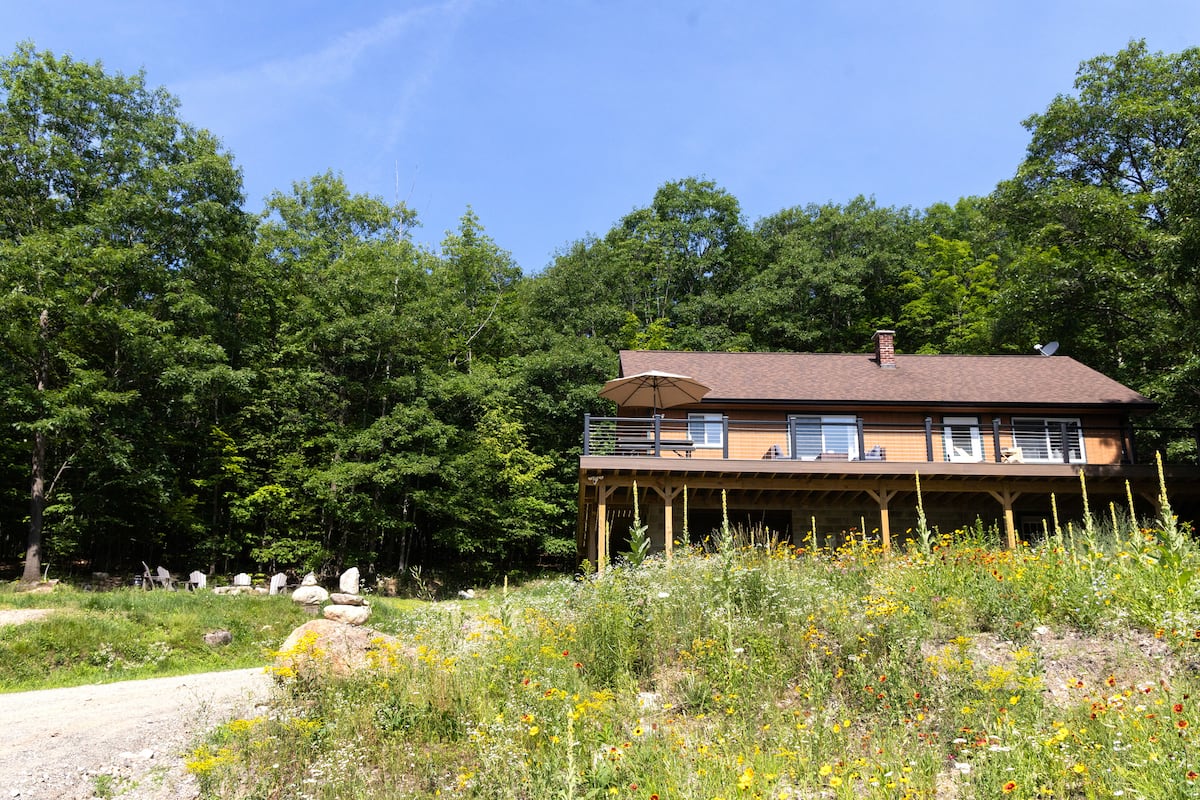 Pull in and exhale — your own cedar house, your own driveway, no neighbors in sight.