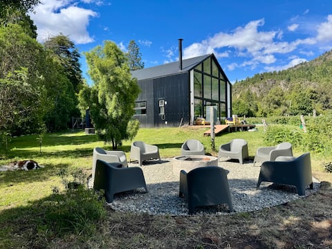 Modern house in raspberry field