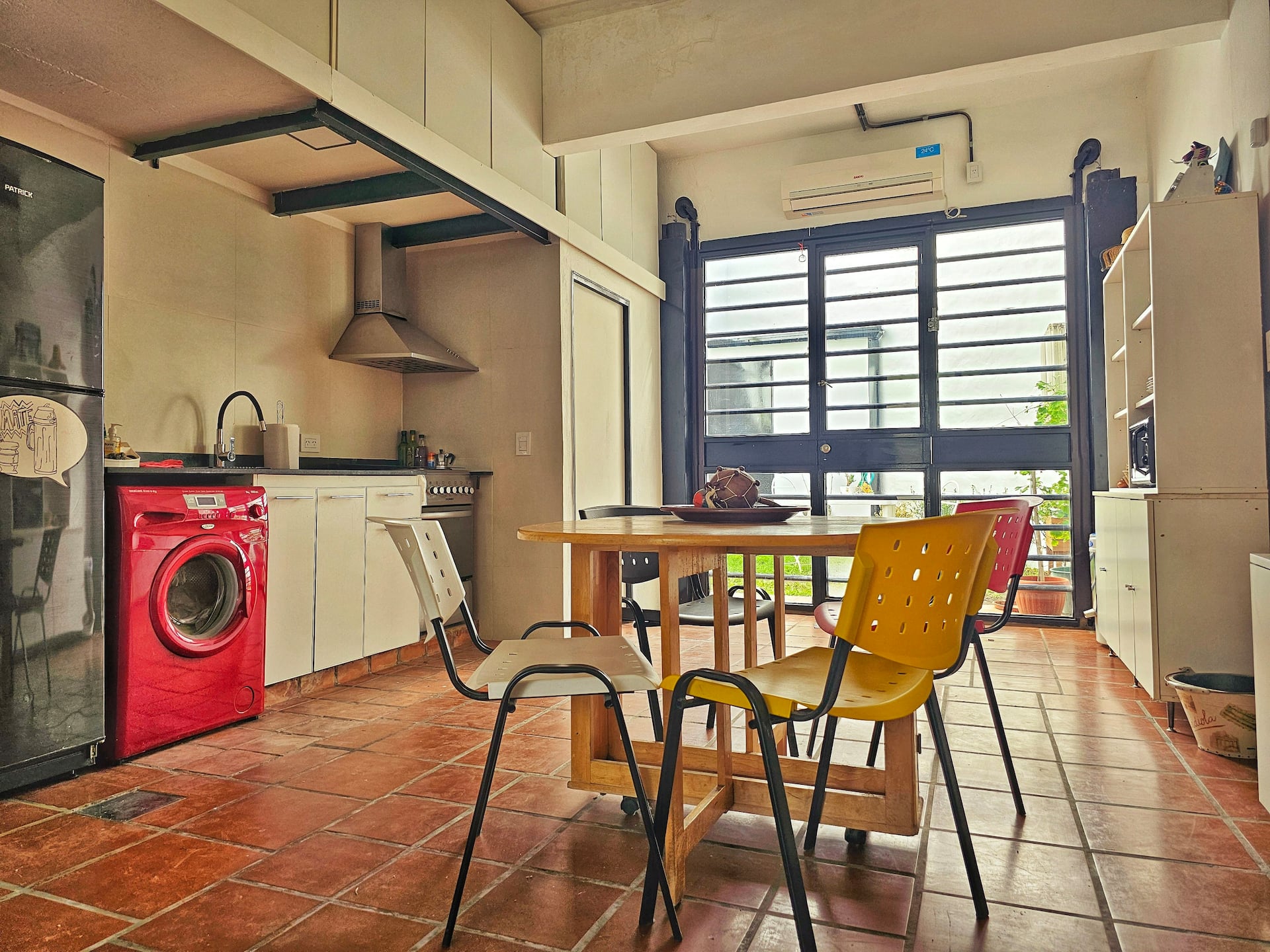 A bright loft-style apartment with a patio