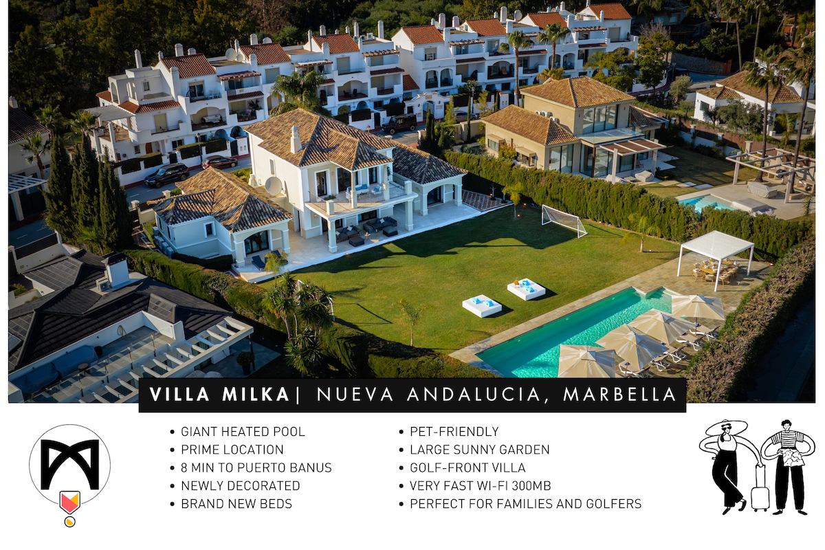 The image displays Villa Milka, a golf-front villa featuring a large, heated pool surrounded by sun loungers and a spacious garden. The modern design is complemented by the villa's recent decoration, with a prime location visible in the picturesque setting of Nueva Andalucia.