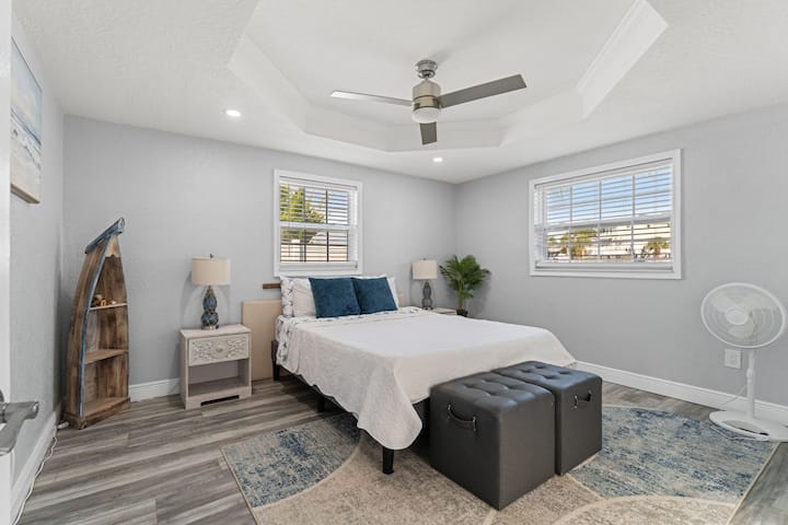 Comfortable queen bedroom with natural light and plenty of space to relax.