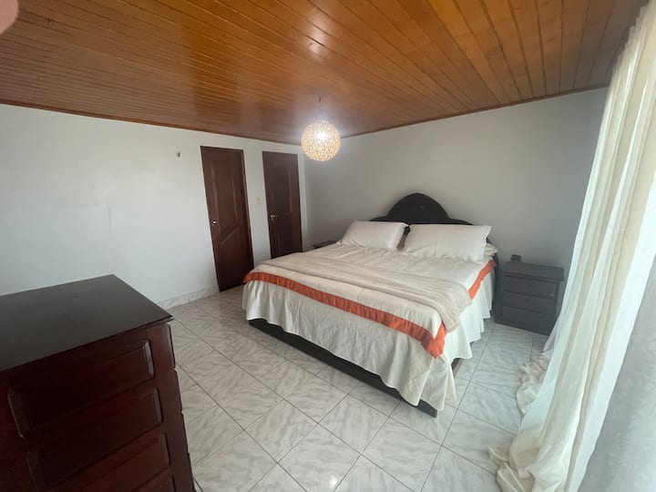 The Sea Suite is super comfortable on the 2nd level of the house, king-size bed, balcony with a beautiful view of the sea, air-conditioning, ventilated and illuminated environment, dresser for storing clothes, hooks for hammocks on the balcony and in the bedroom.