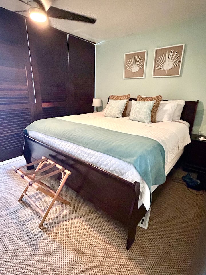Large Mahogany shutters to separate the bedroom from the living area.