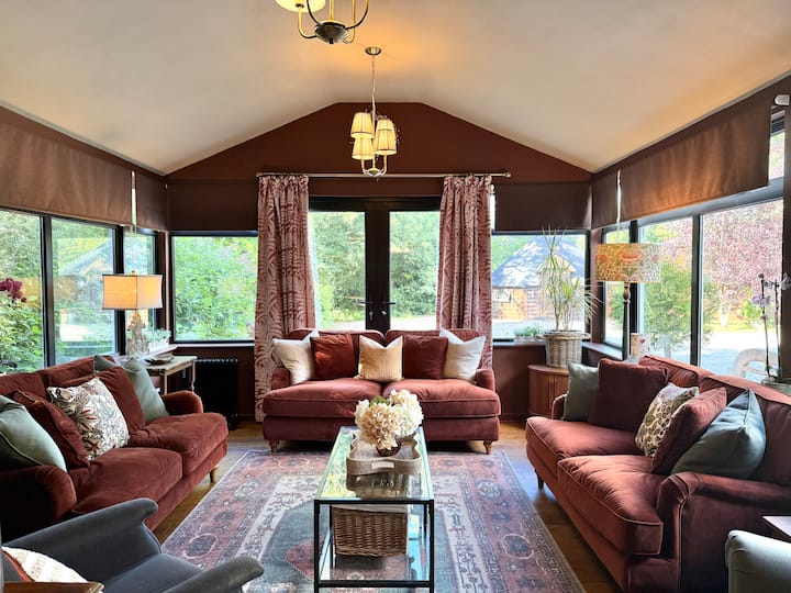 Living room with sofa bed and beautiful views of gardens and grounds