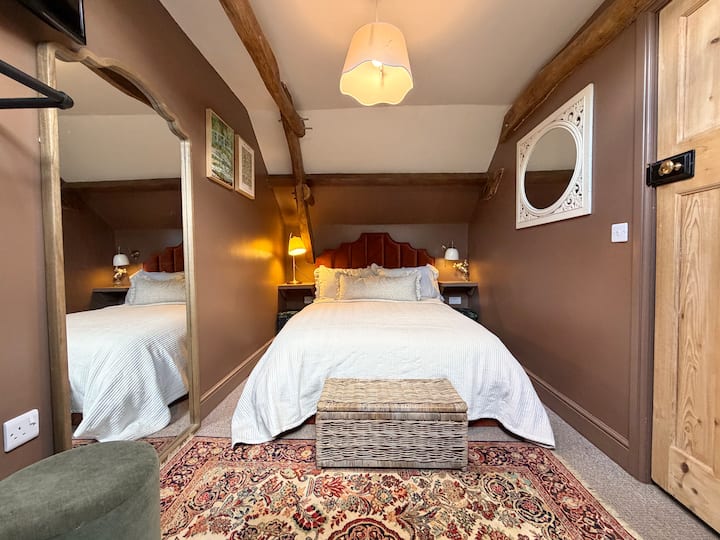 Bedroom with 1 double bed and 2 singles - both ottoman storage beds for extra storage