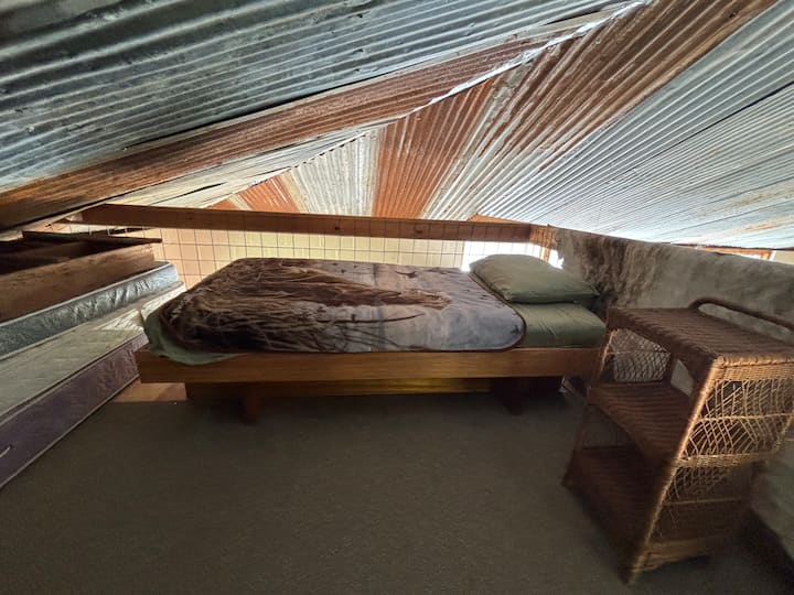 Single bed in the overhead loft