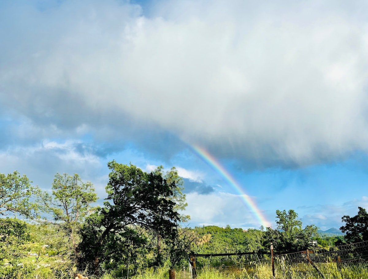Rain brings rainbows in the Spring. Absolutely gorgeous. at Panoramic View Campsite – bring your own tent or small camper in Hidden Valley Lake