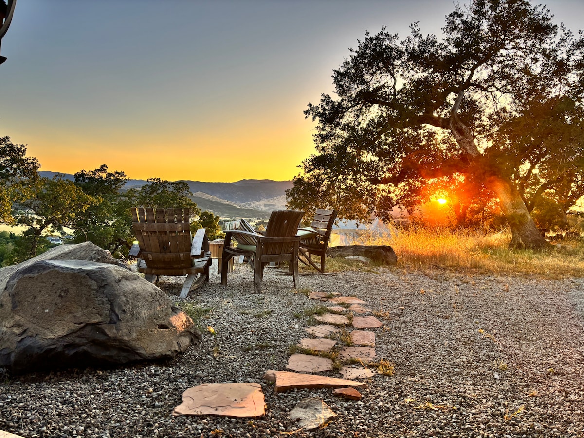 Sunset, May, by our handmade antique Adirondack chairs made from oak wine barrels, a local wine country craft. at Panoramic View Campsite – bring your own tent or small camper in H