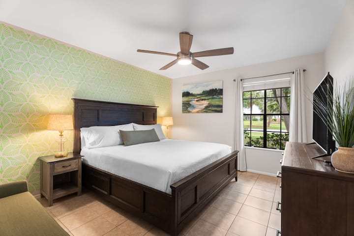 Across from the master, the second bedroom includes a cozy king bed, large closet, and TV — perfect for relaxing after a day out.